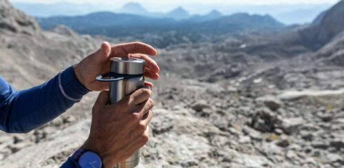 Person hydrating during a hike